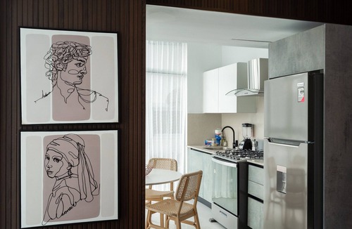 Ensanche Quisqueya Apartment | 1BR Piantini King Suite Near Blue Mall, Pool & Sauna | YellowKey