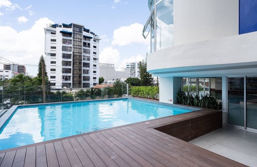 Ensanche Quisqueya Apartment | 1BR Piantini King Suite Near Blue Mall, Pool & Sauna | YellowKey