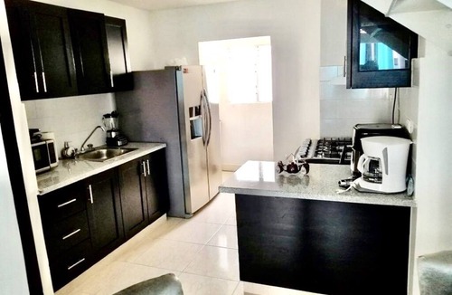 Licey al Medio Apartment | Comfortable apartment, 24/7 security, 8 minutes from the airport.