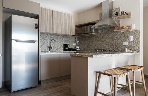 Downtown Santo Domingo Condo | Designer condo near Blue Mall with rooftop pool and city views | YellowKey