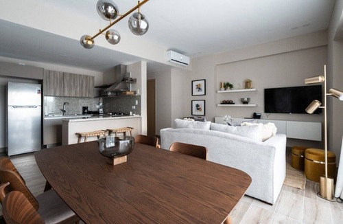 Downtown Santo Domingo Condo | Designer condo near Blue Mall with rooftop pool and city views | YellowKey