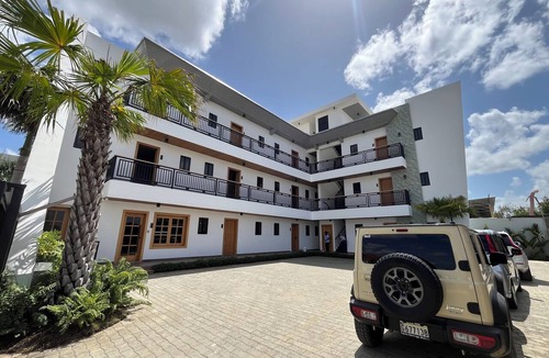 Higuey Apartment | Luxury Minimalist Suite with a Private Living Room and Kitchenette, near the squares.