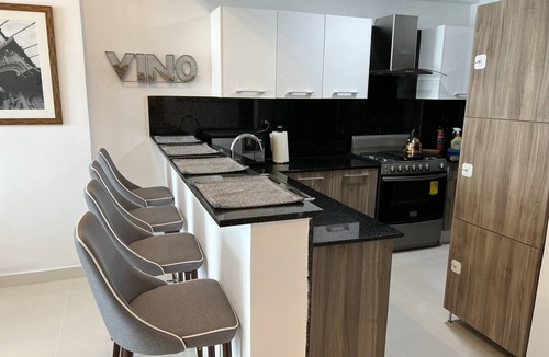 Downtown Santo Domingo Condo | Rooftop Pool with Ocean and City Views