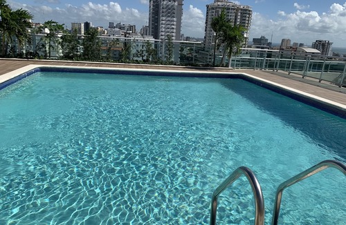 Downtown Santo Domingo Condo | Rooftop Pool with Ocean and City Views