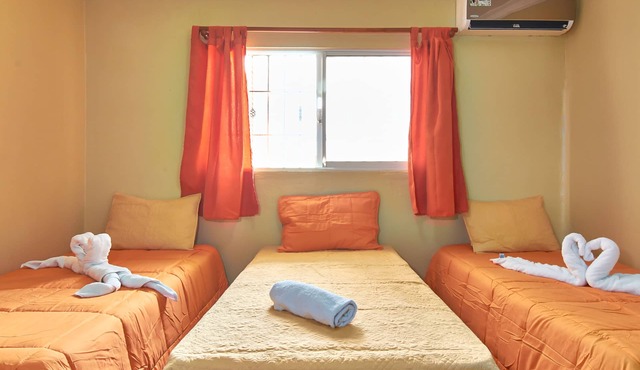 1-Bedroom Apartment with 3 Single Beds Near SDQ Airport Fast Wi-Fi & Free Pa