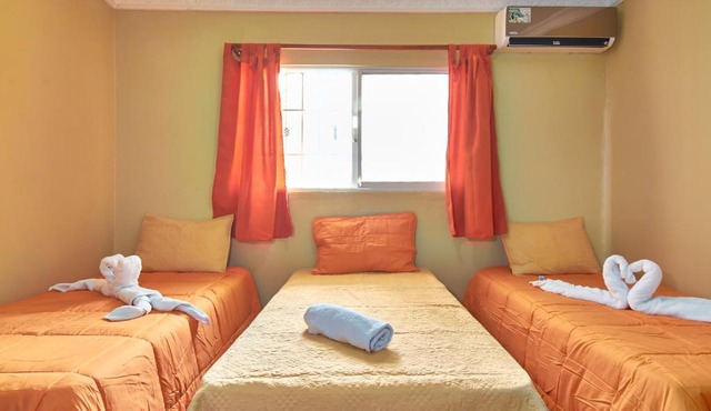 1-Bedroom Apartment with 3 Single Beds Near SDQ Airport Fast Wi-Fi Free Pa