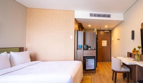 Room with Two Double Beds and Mini Fridge